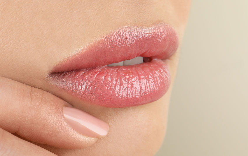 Close up photo of beautiful pink lips highlighting the benefits of dermal filler.